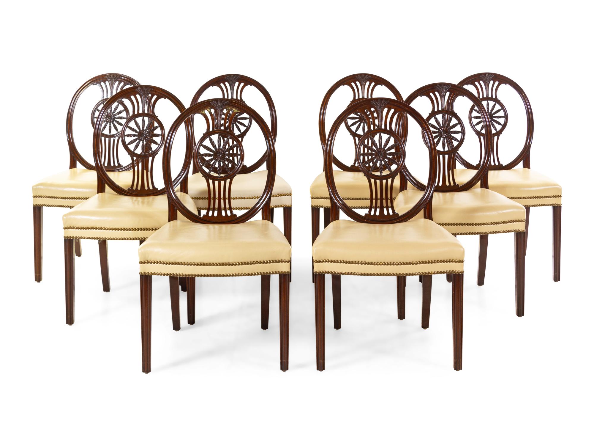 A Set of Eight Regency Style Carved Mahogany Leather-Upholstered Dining Chairs