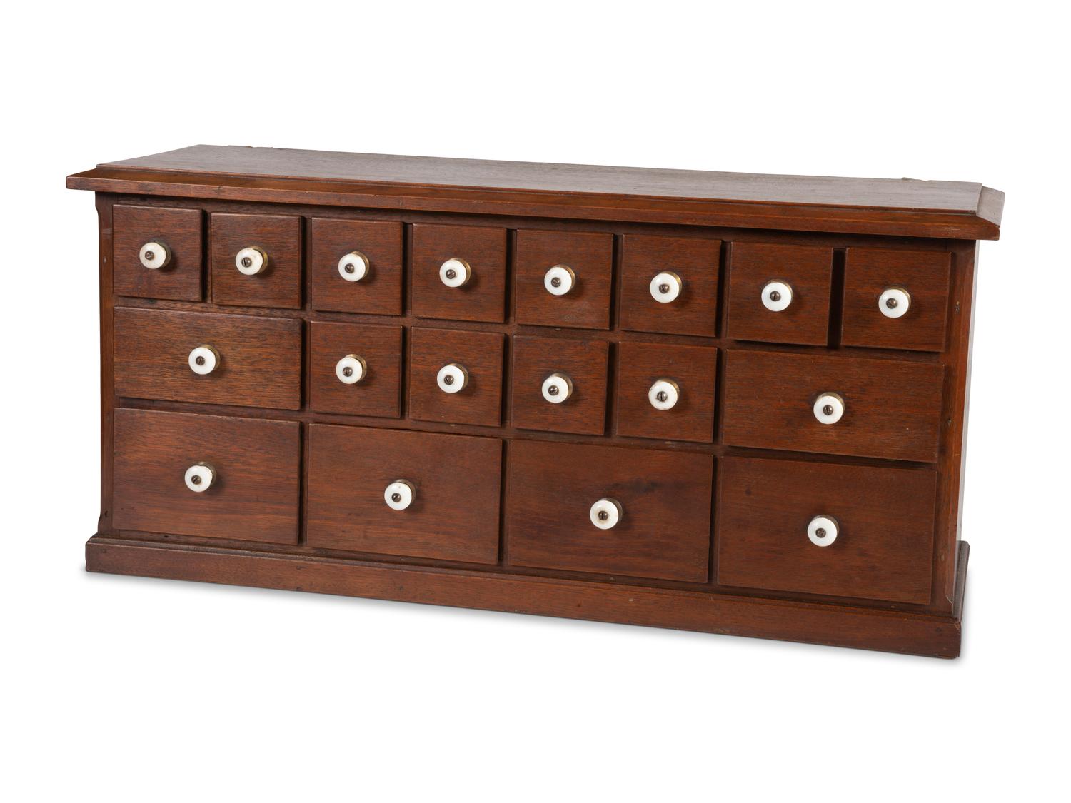 A Miniature Painted Wood Apothecary Cabinet with Porcelain Pulls