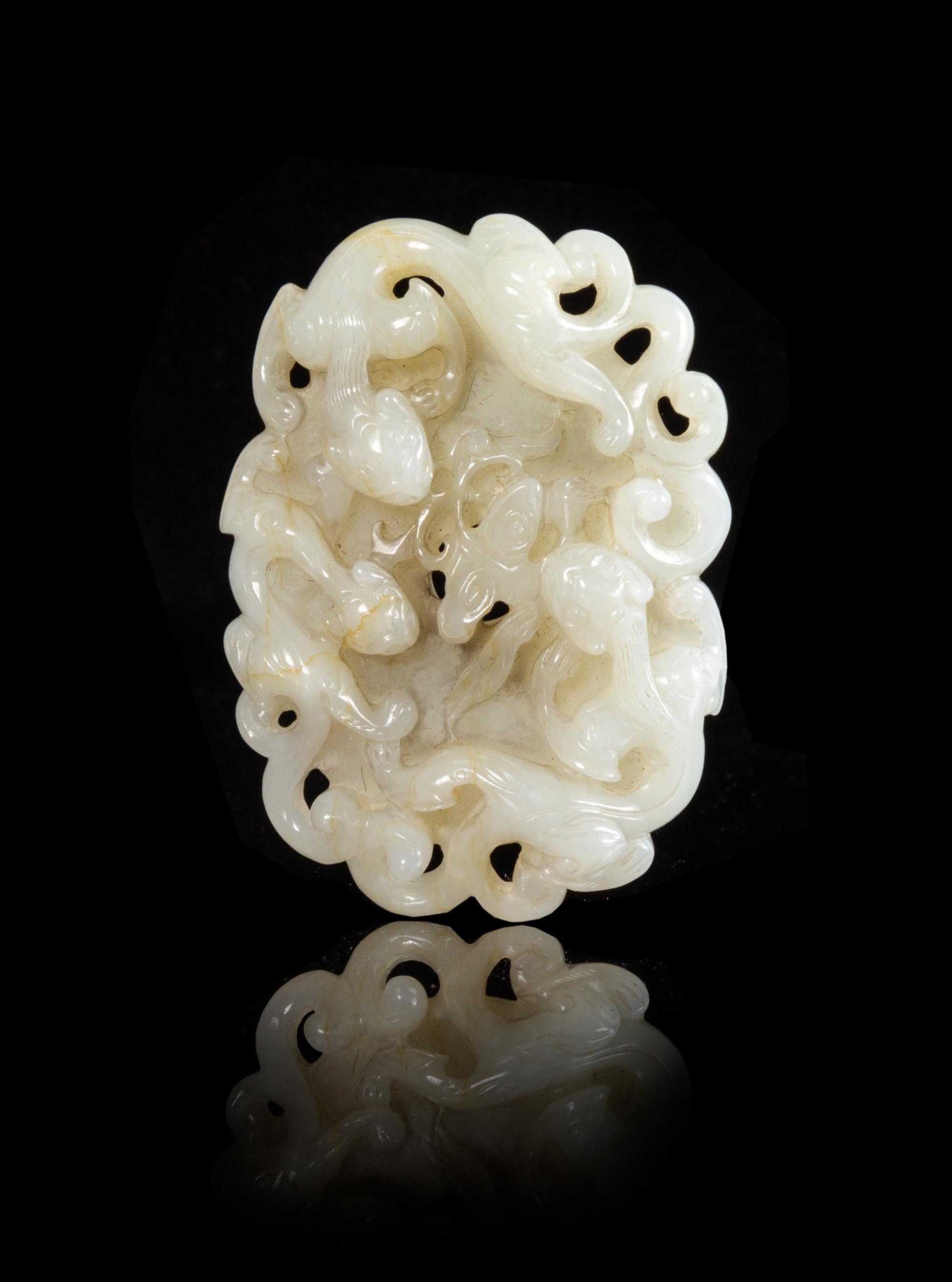A Carved White Jade Plaque Length 2 7/8 inches.