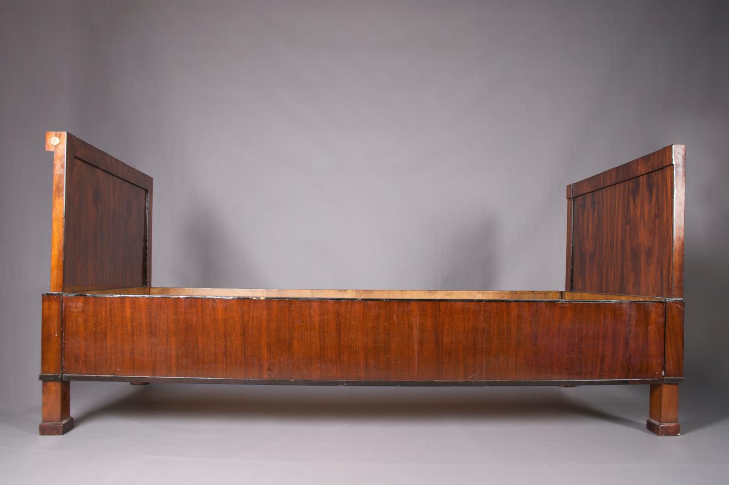 An Empire Mahogany Bed, Height 37 3/4 x width 81 inches.