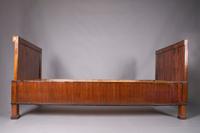 An Empire Mahogany Bed, Height 37 3/4 x width 81 inches.