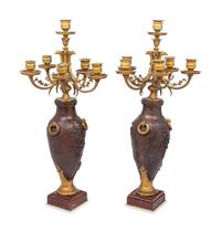 A Pair of Louis XVI Style Gilt and Patinated Bronze Six-Light Candelabra