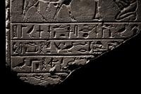An Egyptian Limestone Round-Topped Stele