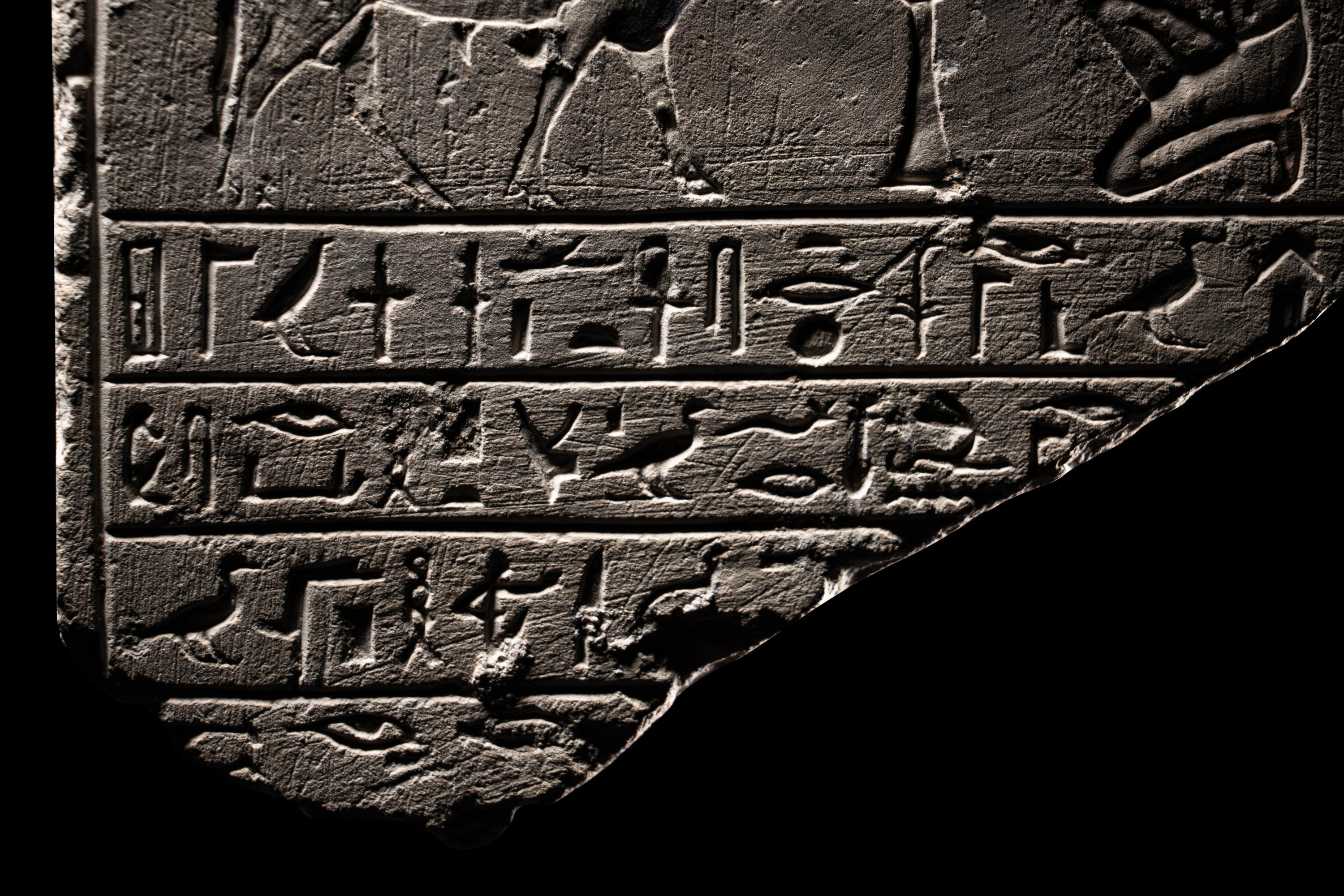 An Egyptian Limestone Round-Topped Stele