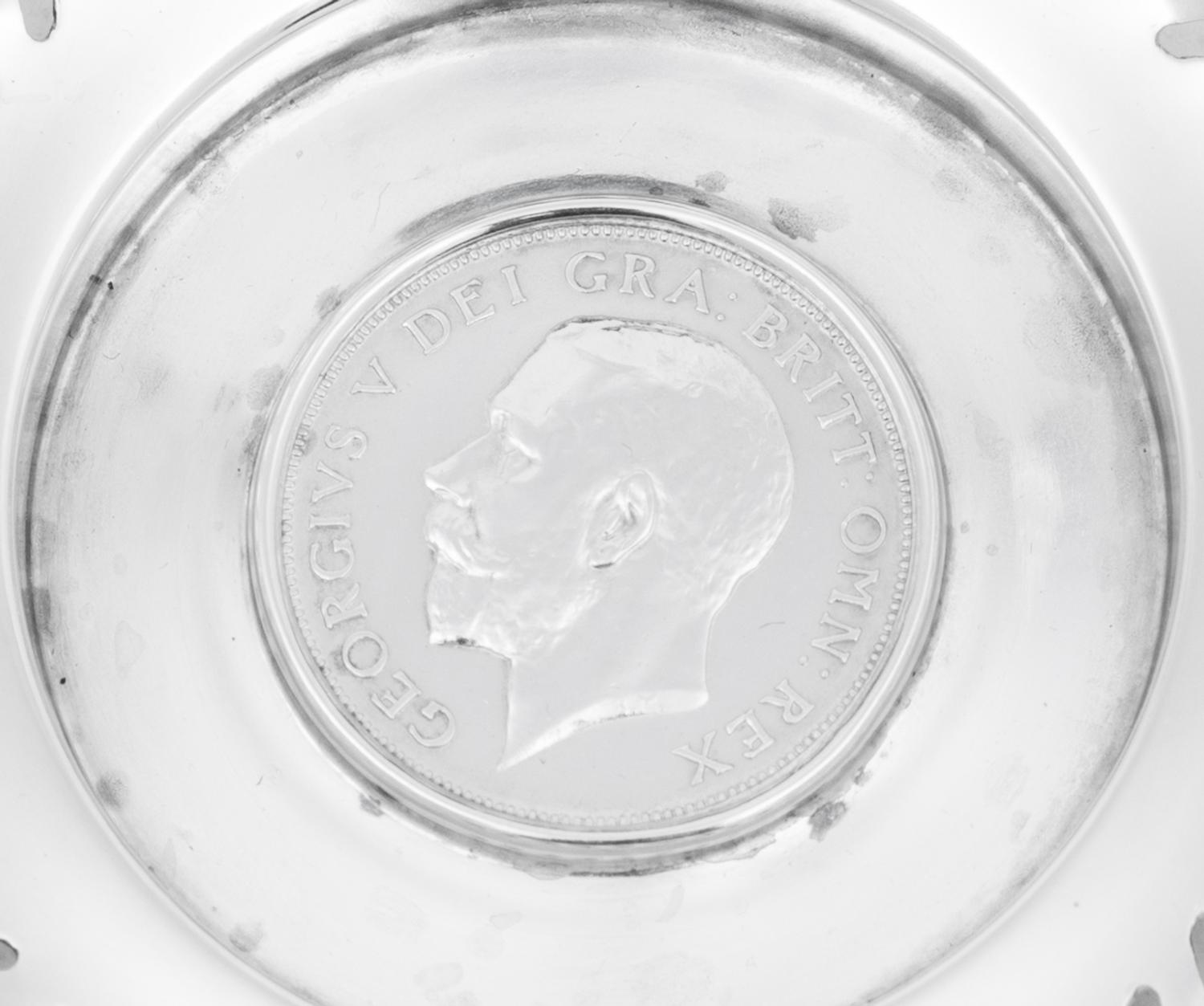 A Set of Four English Silver Coin-Inset Nut Dishes