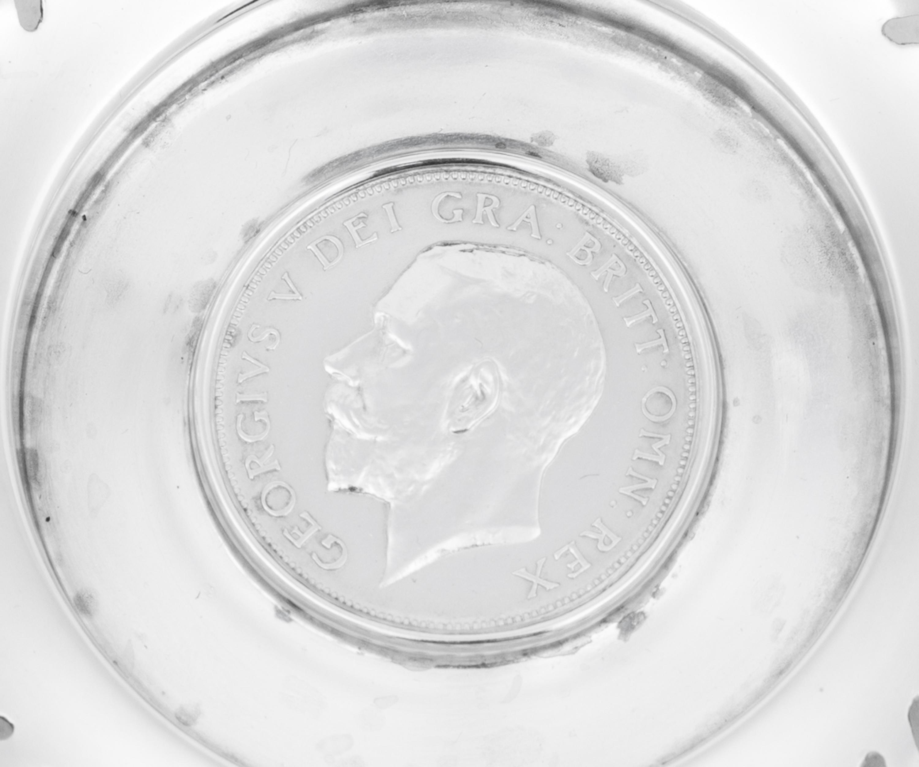 A Set of Four English Silver Coin-Inset Nut Dishes