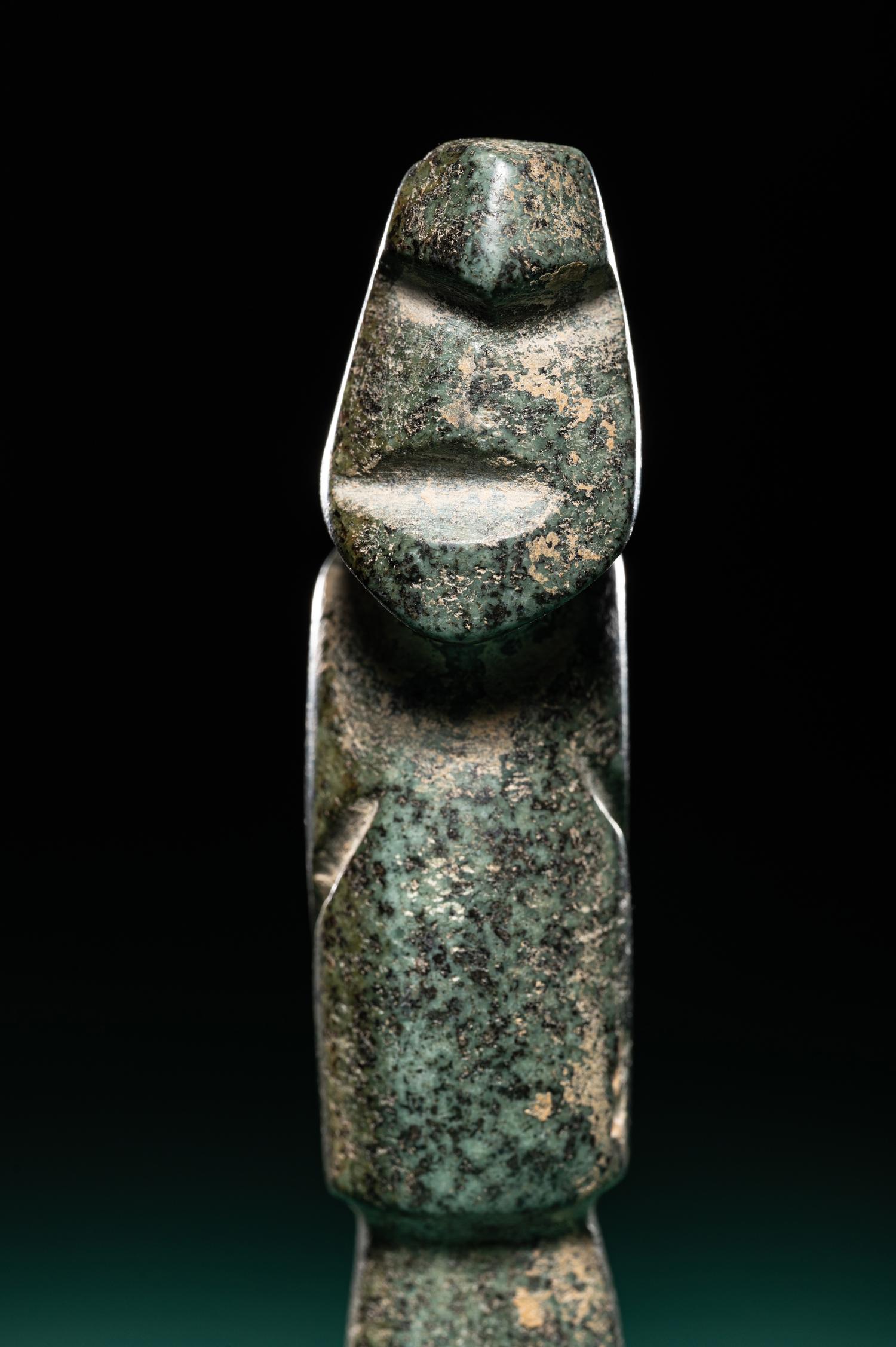 A Mezcala Diorite Standing Figure with an Infant