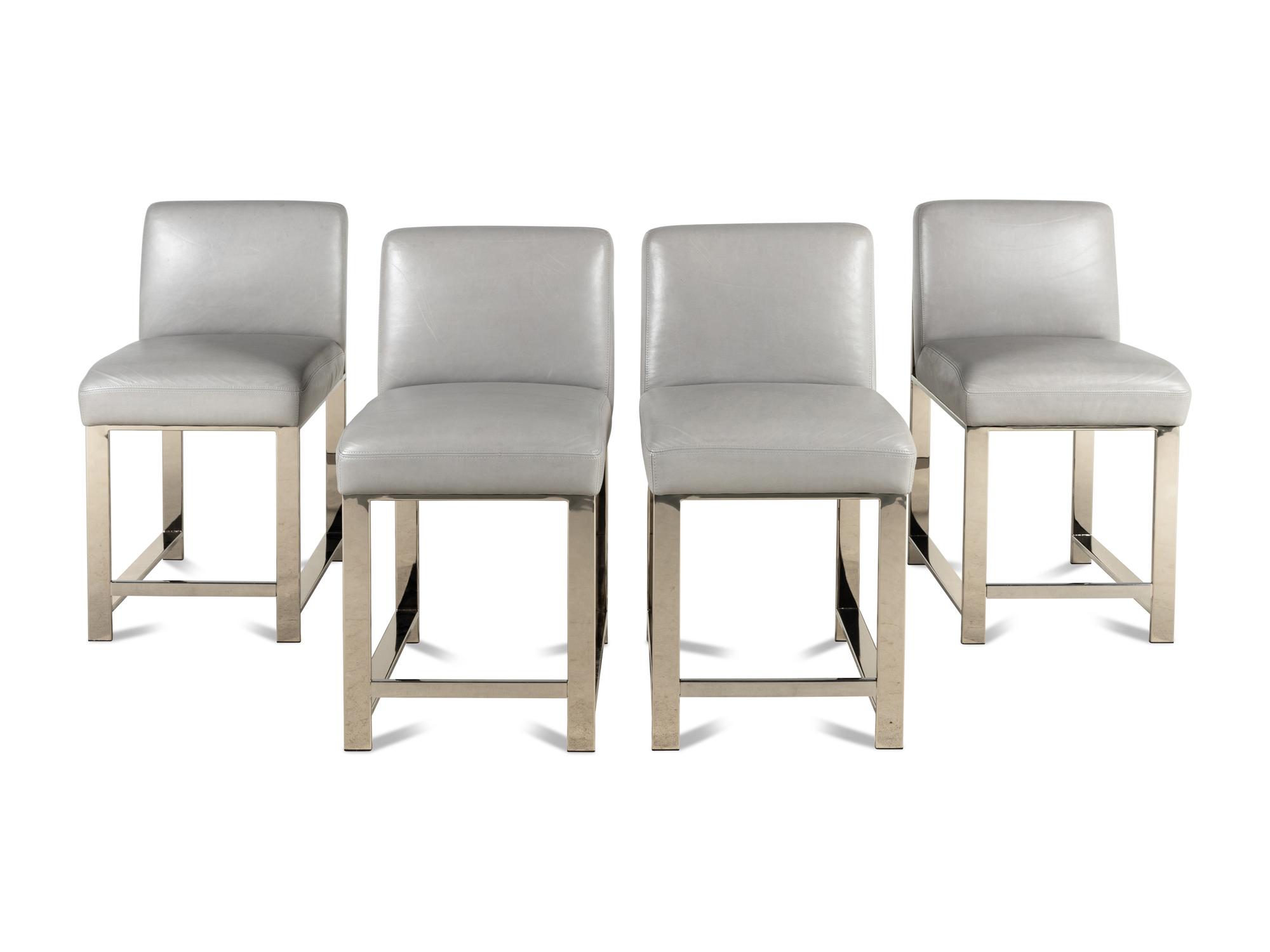 A Set of Four Contemporary Leather-Upholstered Chairs