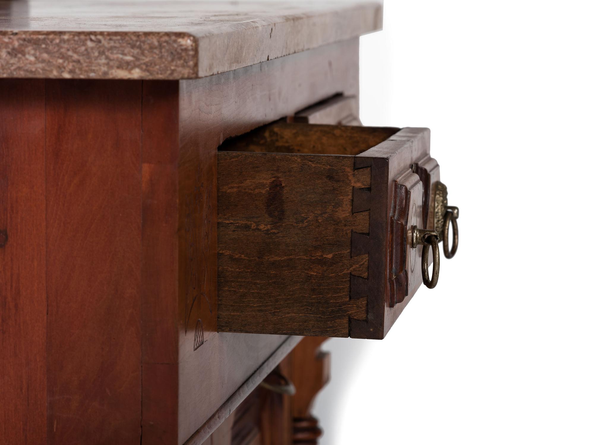 An Eastlake Style Hall Mirror with Marble Top Cabinet Base