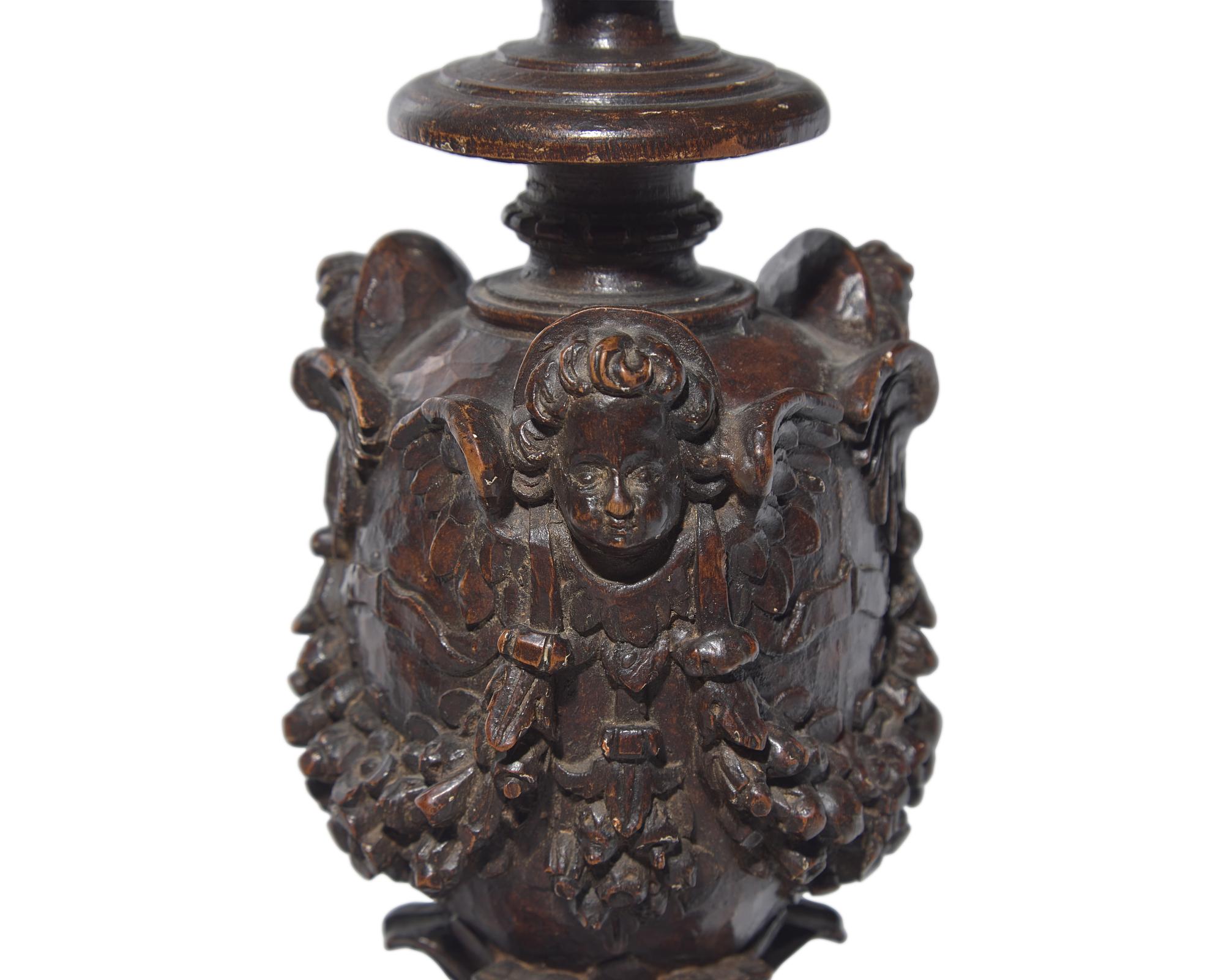 A large Italian Baroque carved walnut pricket candlestick, 16th century