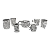 A Collection of Silver Repousse Decorated Table Articles