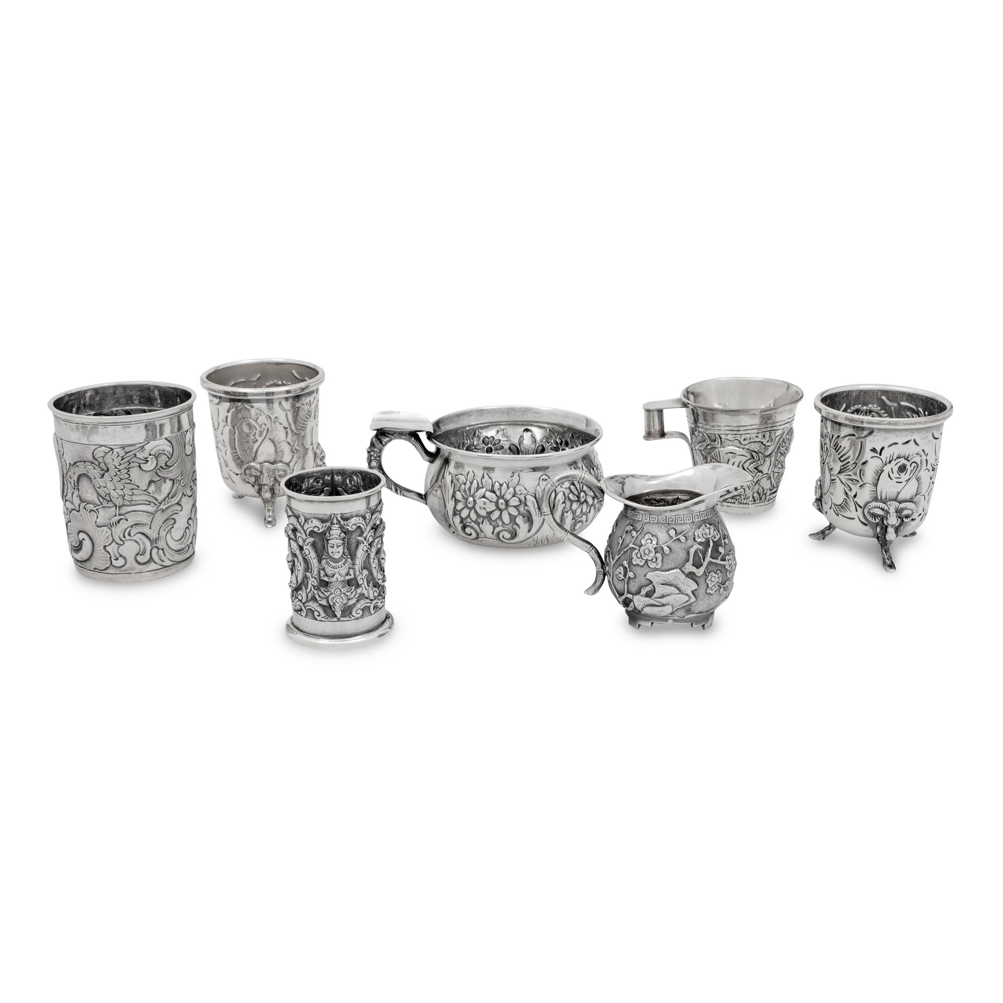 A Collection of Silver Repousse Decorated Table Articles