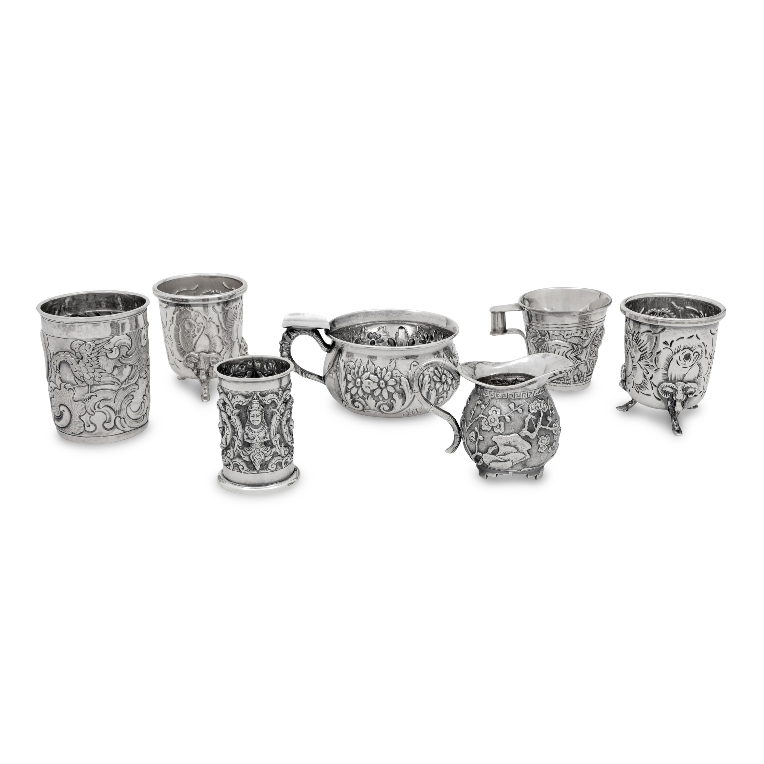 A Collection of Silver Repousse Decorated Table Articles