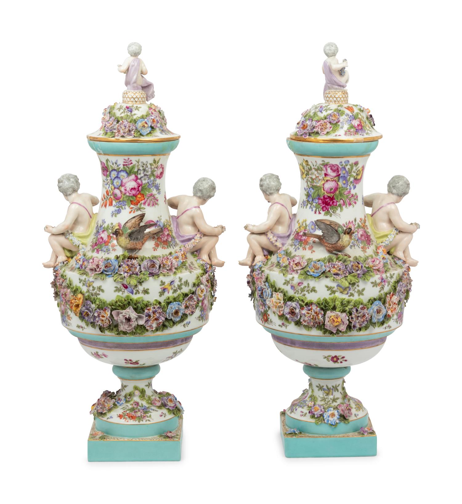 A Pair of Continental Porcelain Urns