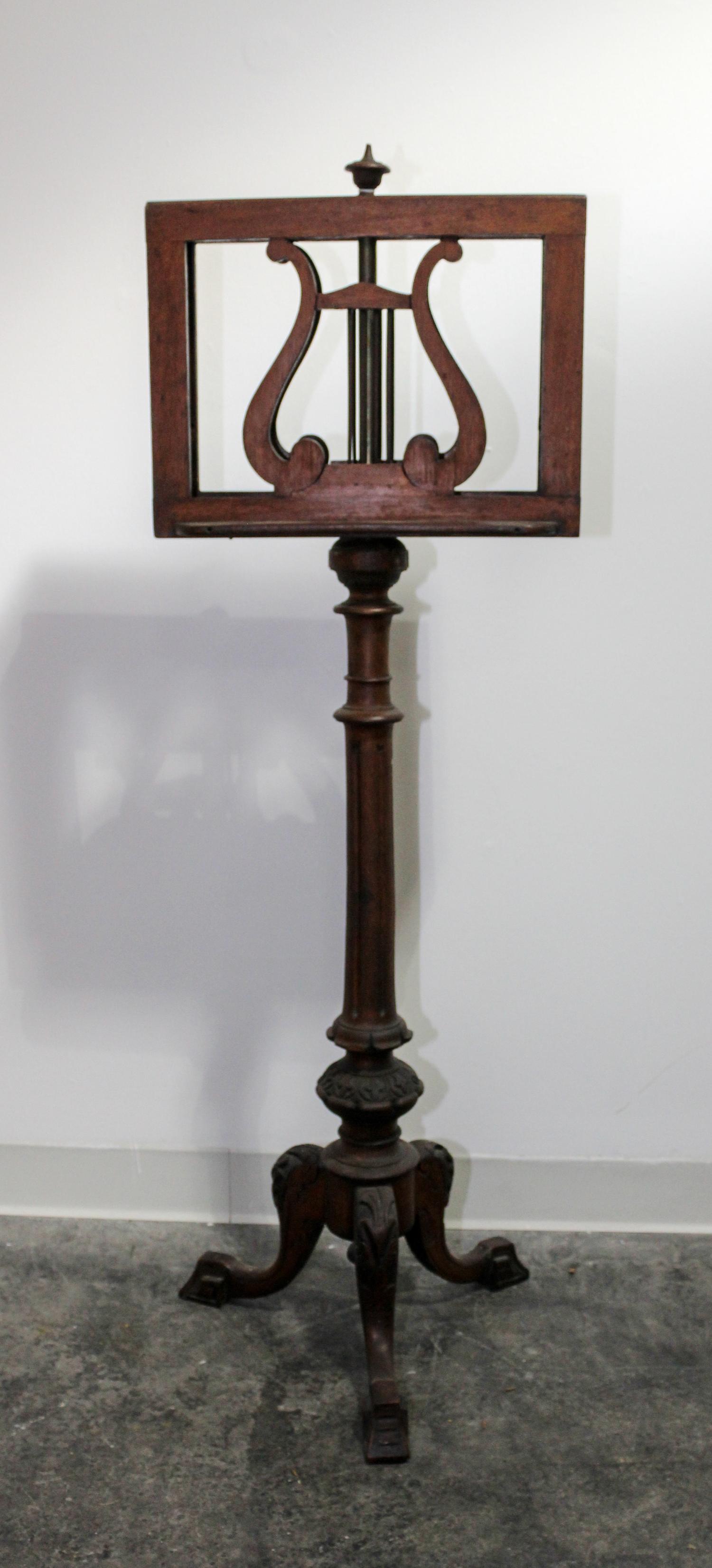 A Victorian Carved Mahogany Duet Stand Height 49 1/2 inches. — 19TH CENTURY