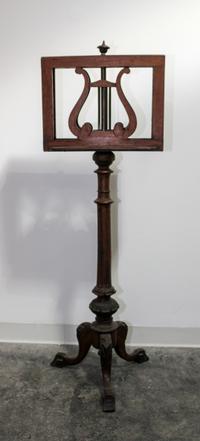 A Victorian Carved Mahogany Duet Stand Height 49 1/2 inches. — 19TH CENTURY