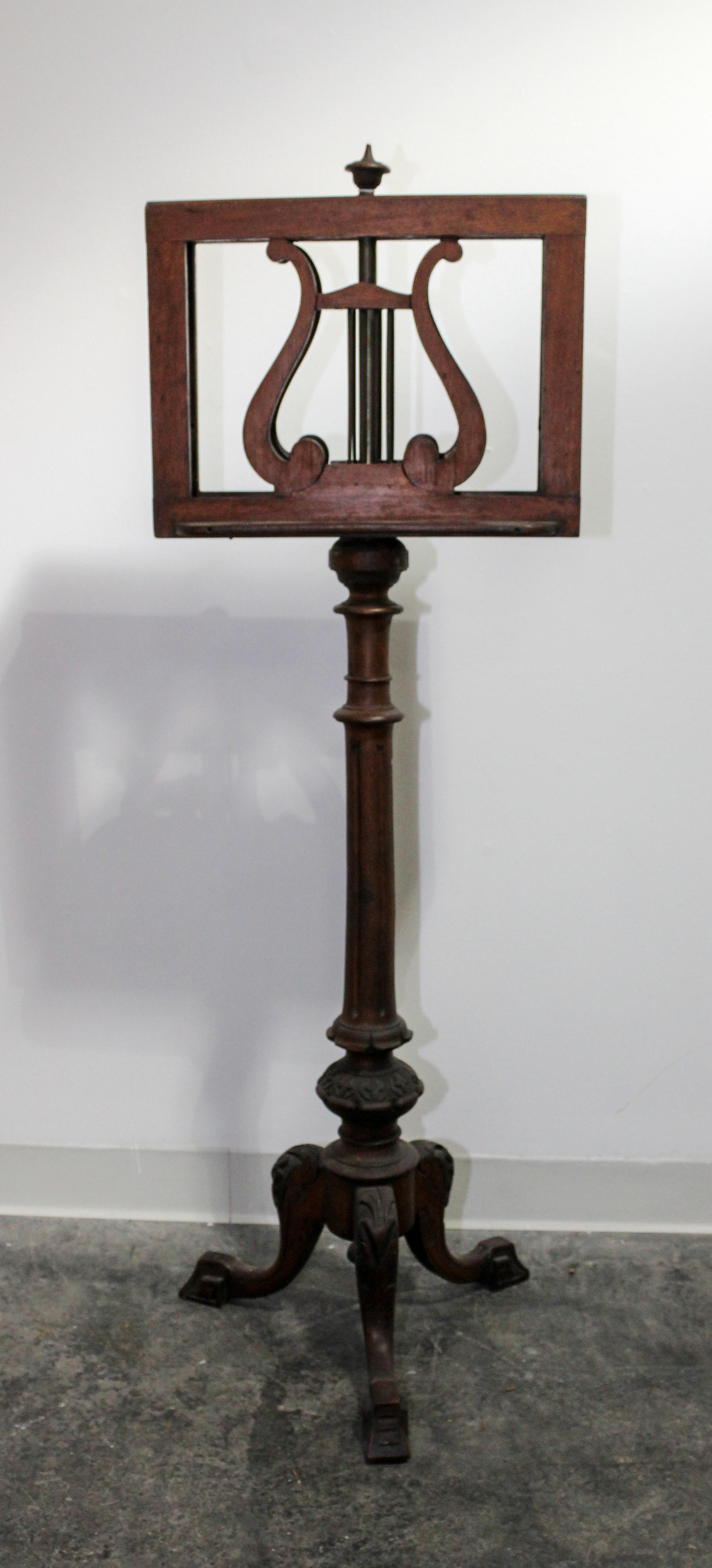 A Victorian Carved Mahogany Duet Stand Height 49 1/2 inches. — 19TH CENTURY