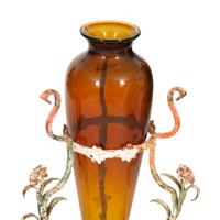 A Pair of Polychrome Painted Metal Stands with Amber Glass Amphora Vases