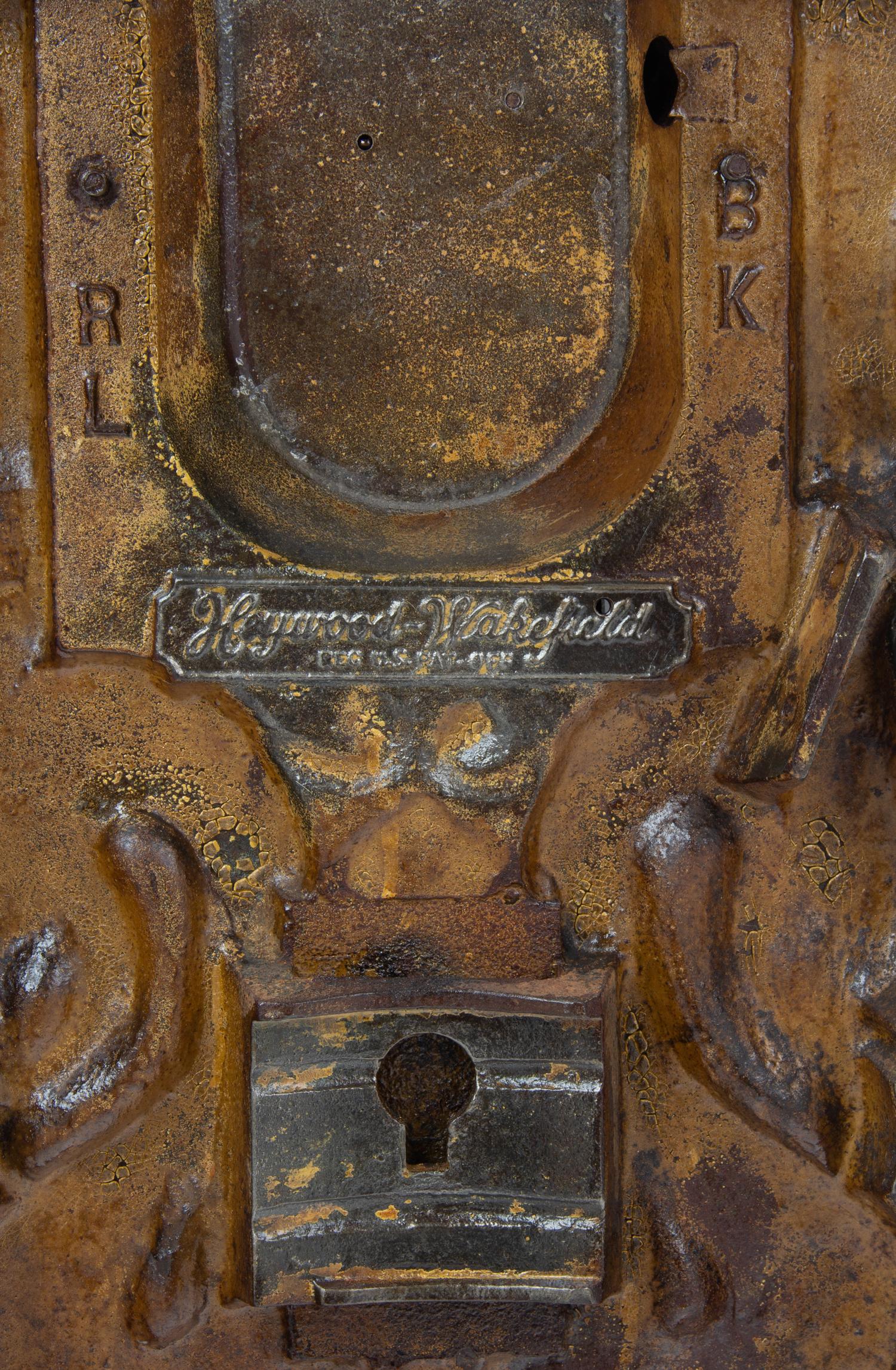An Oriental Theater Auditorium Figural Seat End Height 25 1/2 inches. — CIRCA 1920'S