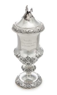 A Russian Silver Cup and Cover, Teodor Werner & Son, Assay Mark Cyrillic S.P., Warsaw, 1874, the foliate finial above the lid with foli