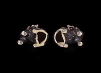 A pair of Chinese export aubergine-glazed porcelain seated dogs, 茄紫釉小狗一對