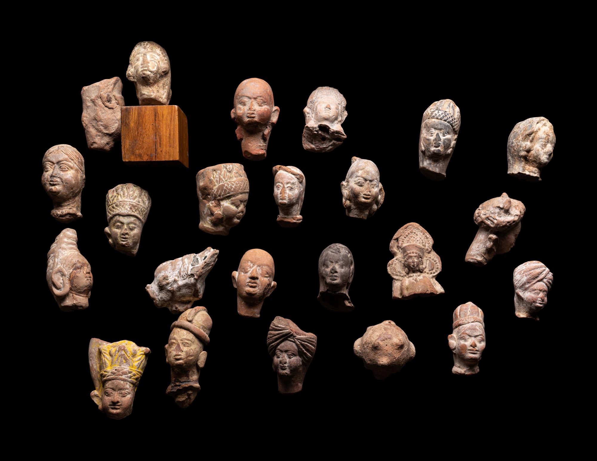 A Group of 65 Gandharan Terracotta Heads