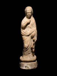 A Greek Terracotta Figure of a Young Woman