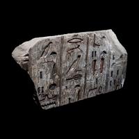 An Egyptian Polychrome Limestone Relief Fragment