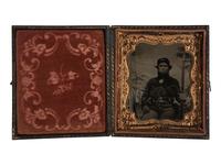 [CIVIL WAR]. Sixth plate copy tintype of a fully equipped infantry private with military backdrop.