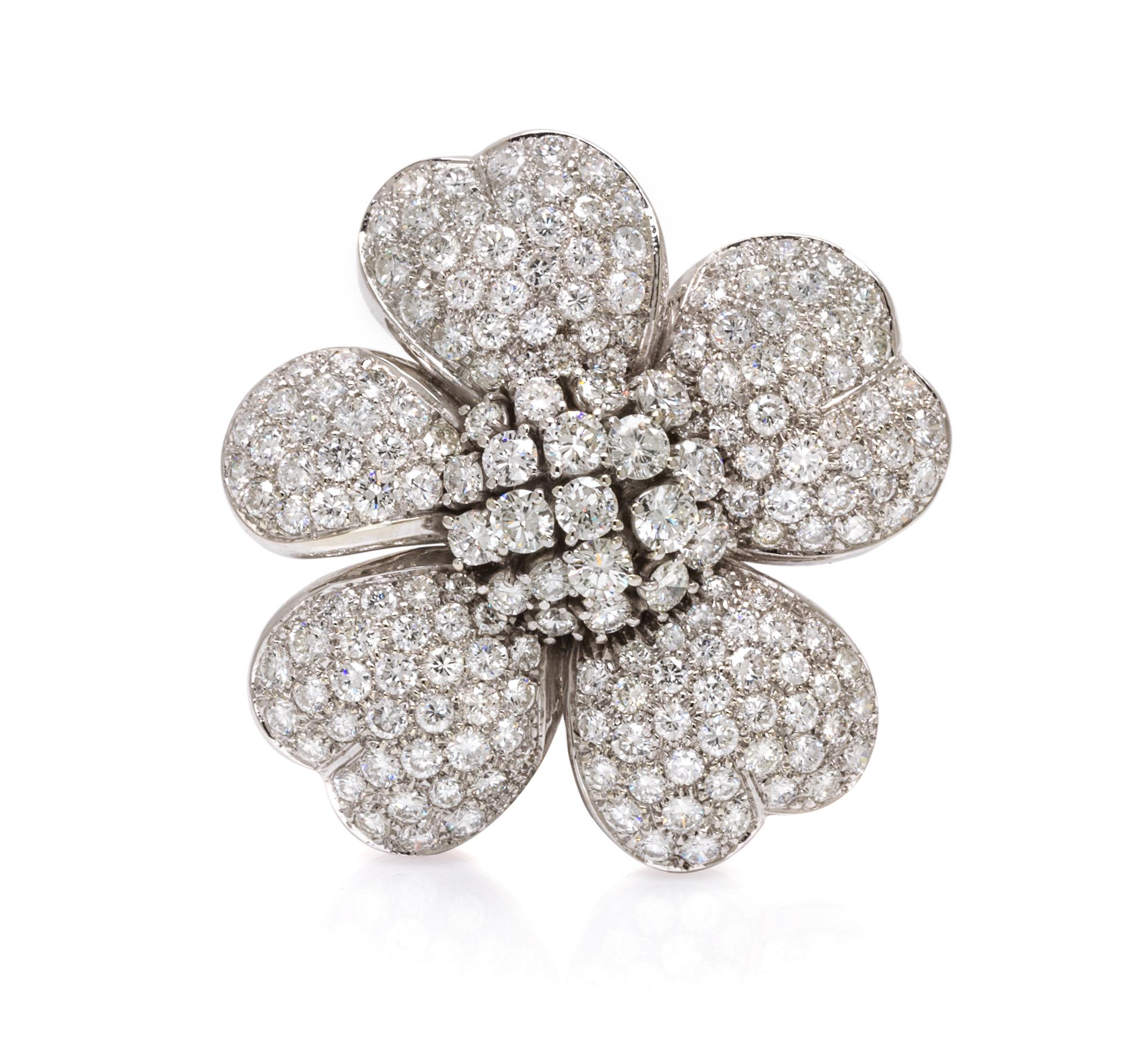 An 18 Karat White Gold and Diamond Flower Brooch, 16.00 dwts.