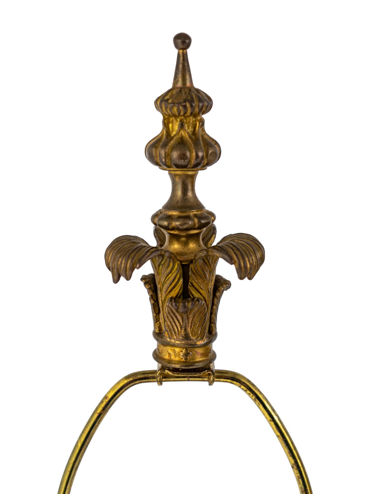 A Pair of Tole and Glass Lamps