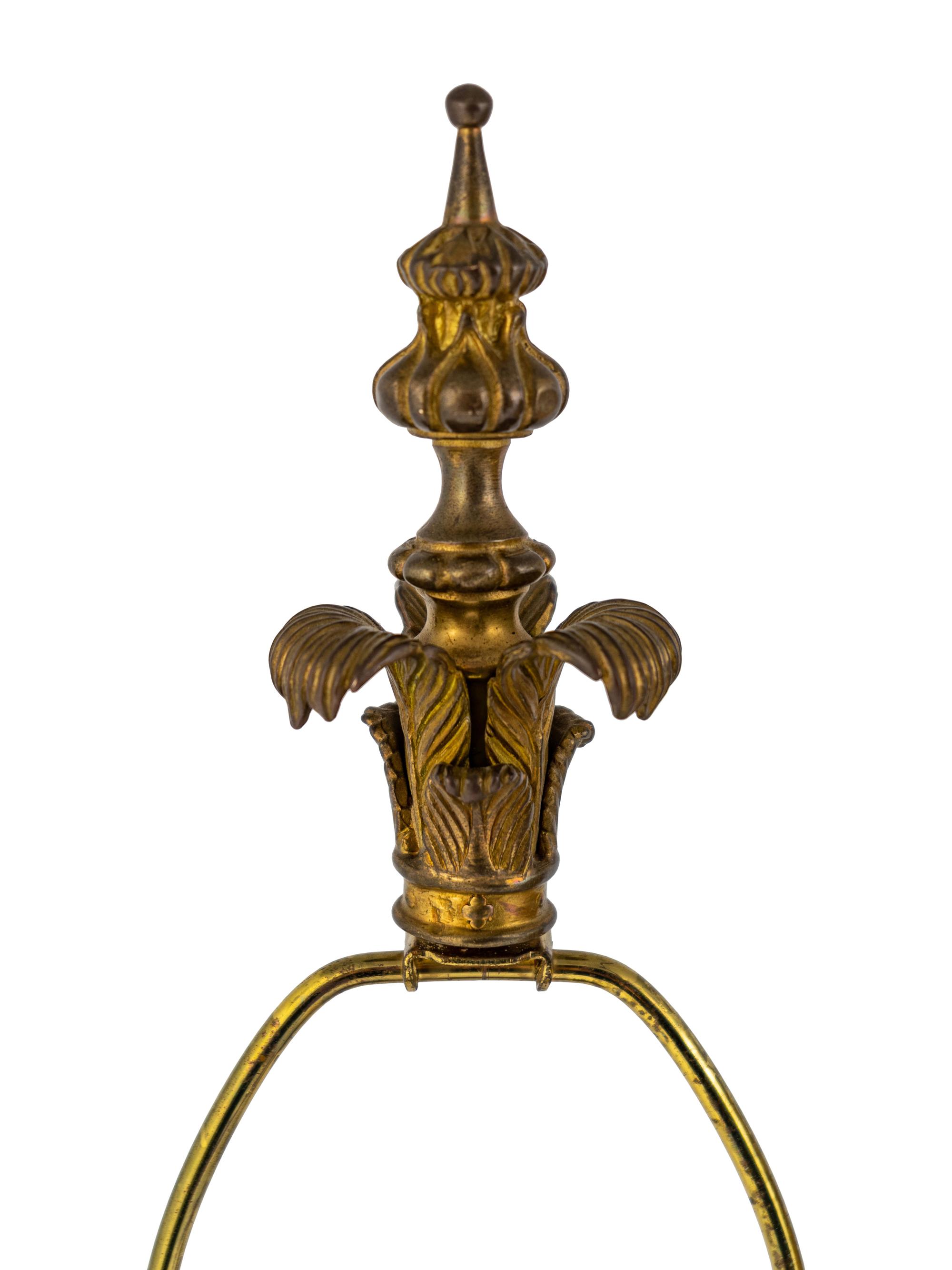 A Pair of Tole and Glass Lamps