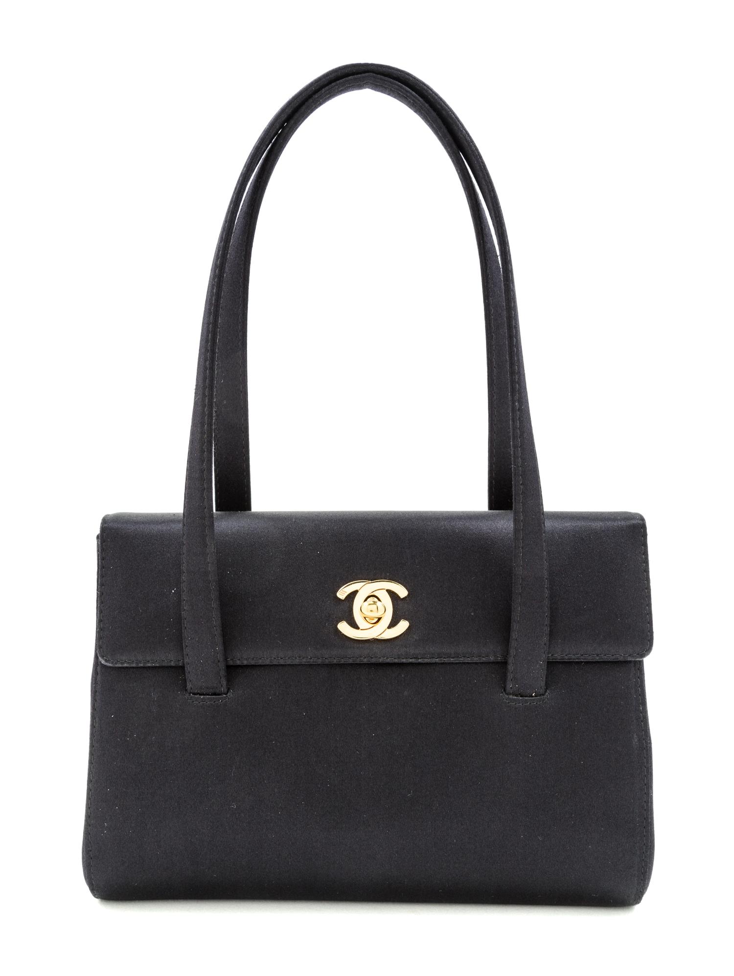 A Chanel Black Satin Small Flap Handbag, 7.5" x 5.5" x 1.75"; Handle drop: 5.5".