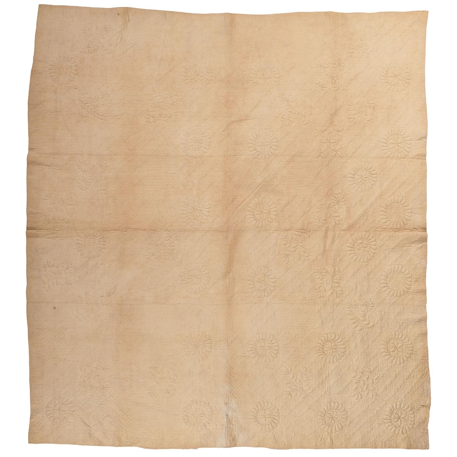 A Monkey Wrench Trapunto Quilt
