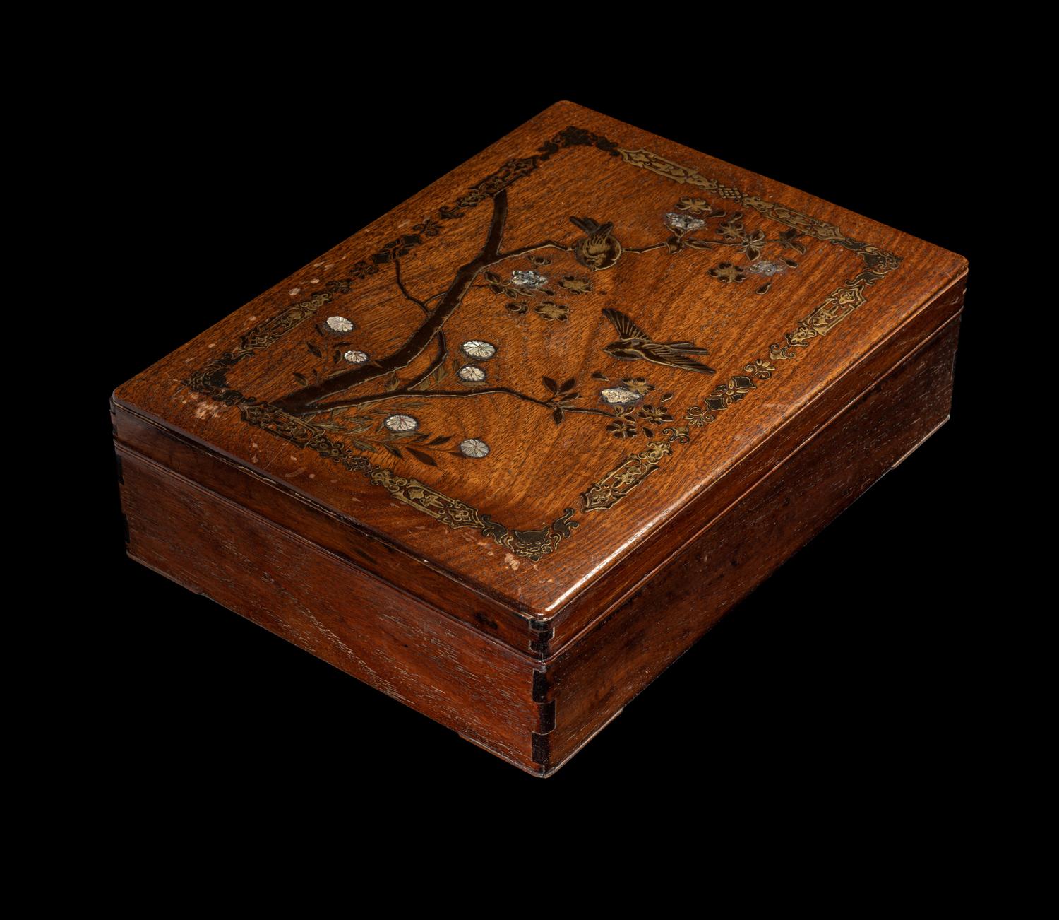 A Japanese Mother-of-Pearl Inlaid Gilt and Black Lacquered Hardwood Stationary Box