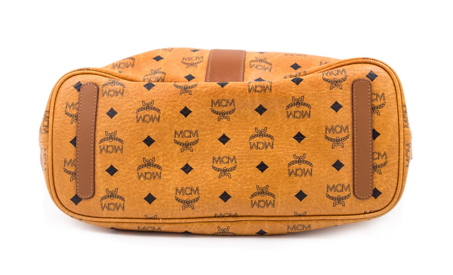 An MCM Cognac Reversible Liz Visetos Shopper Tote, 12" H x 13" W x 6" D; Strap drop: 8.75".