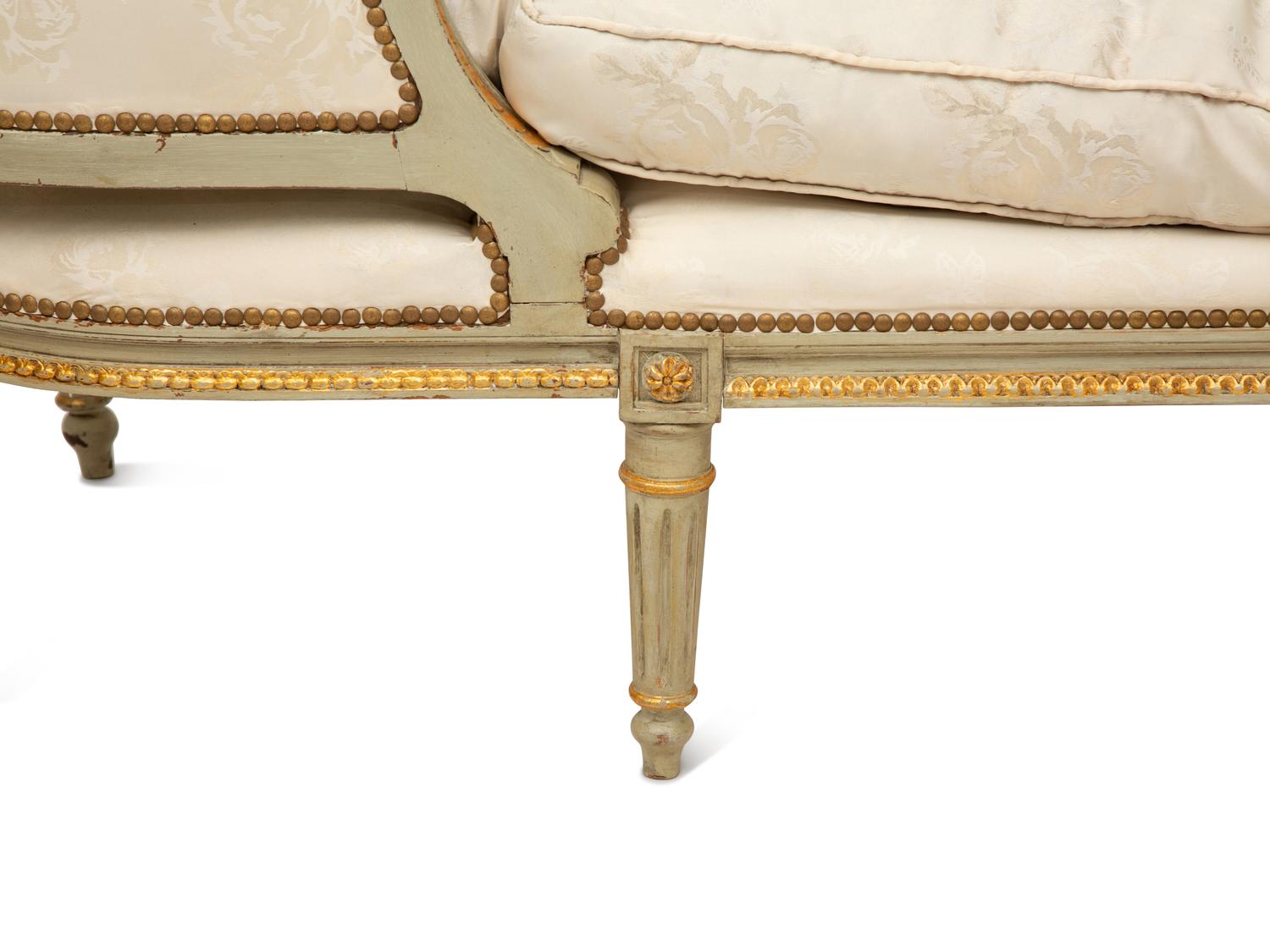 A French Provincial Style Painted and Parcel Gilt Chaise Longue