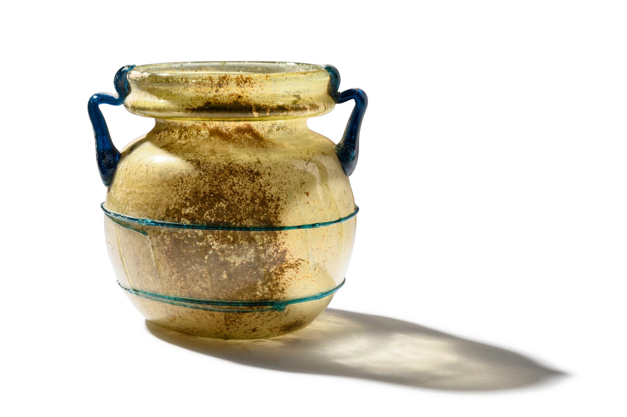 A Roman Yellow Glass Jar with Blue Spiral Trail