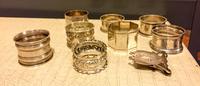A Collection of American and English Silver Napkin Rings, , of varying designs and makers.