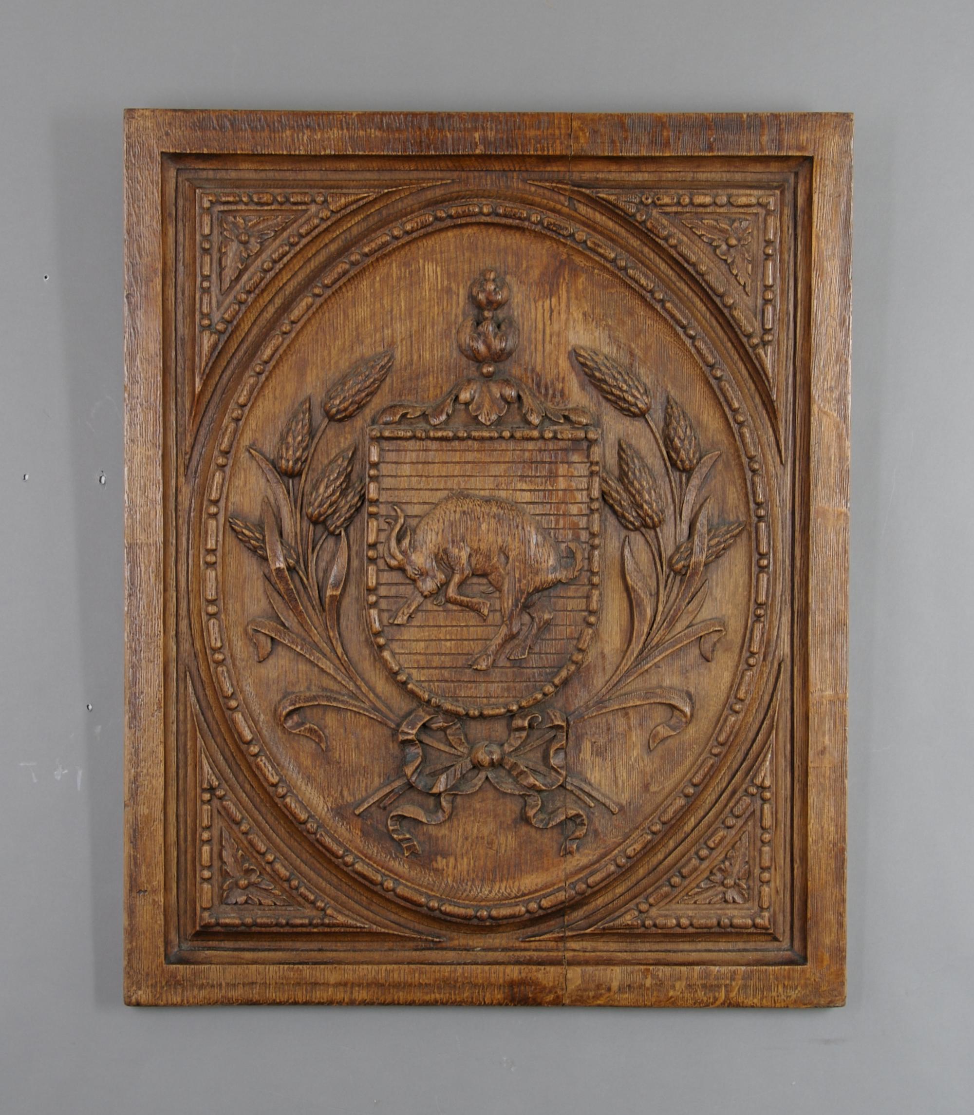 A Carved Oak Relief Panel, Height 24 x width 19 1/2 inches.