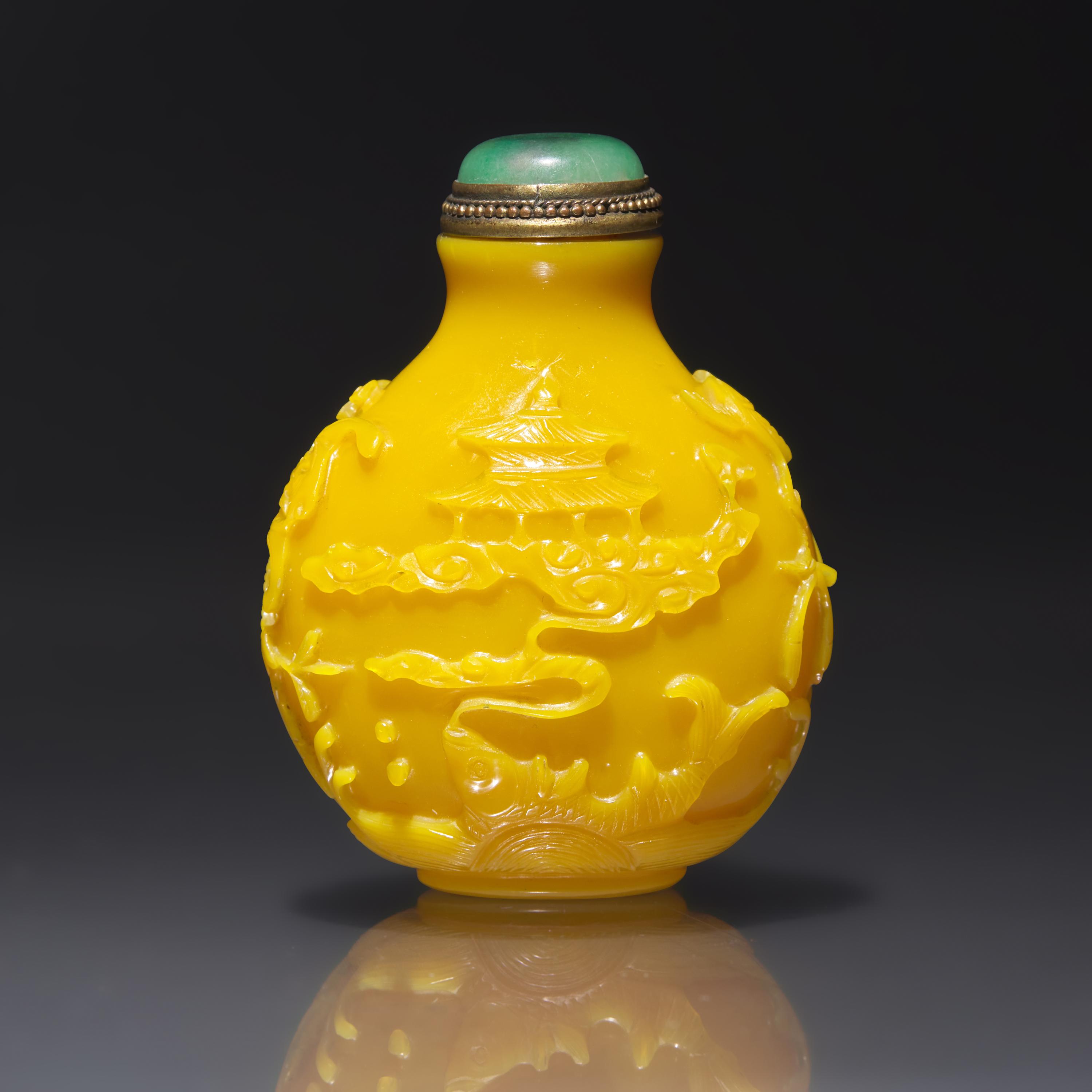 An Imperial Chinese Carved Yellow Glass Snuff Bottle, Qing Dynasty, Circa 1750-1820 — 1750-1820年 御製鷄油黃料吉祥圖鼻煙壺
