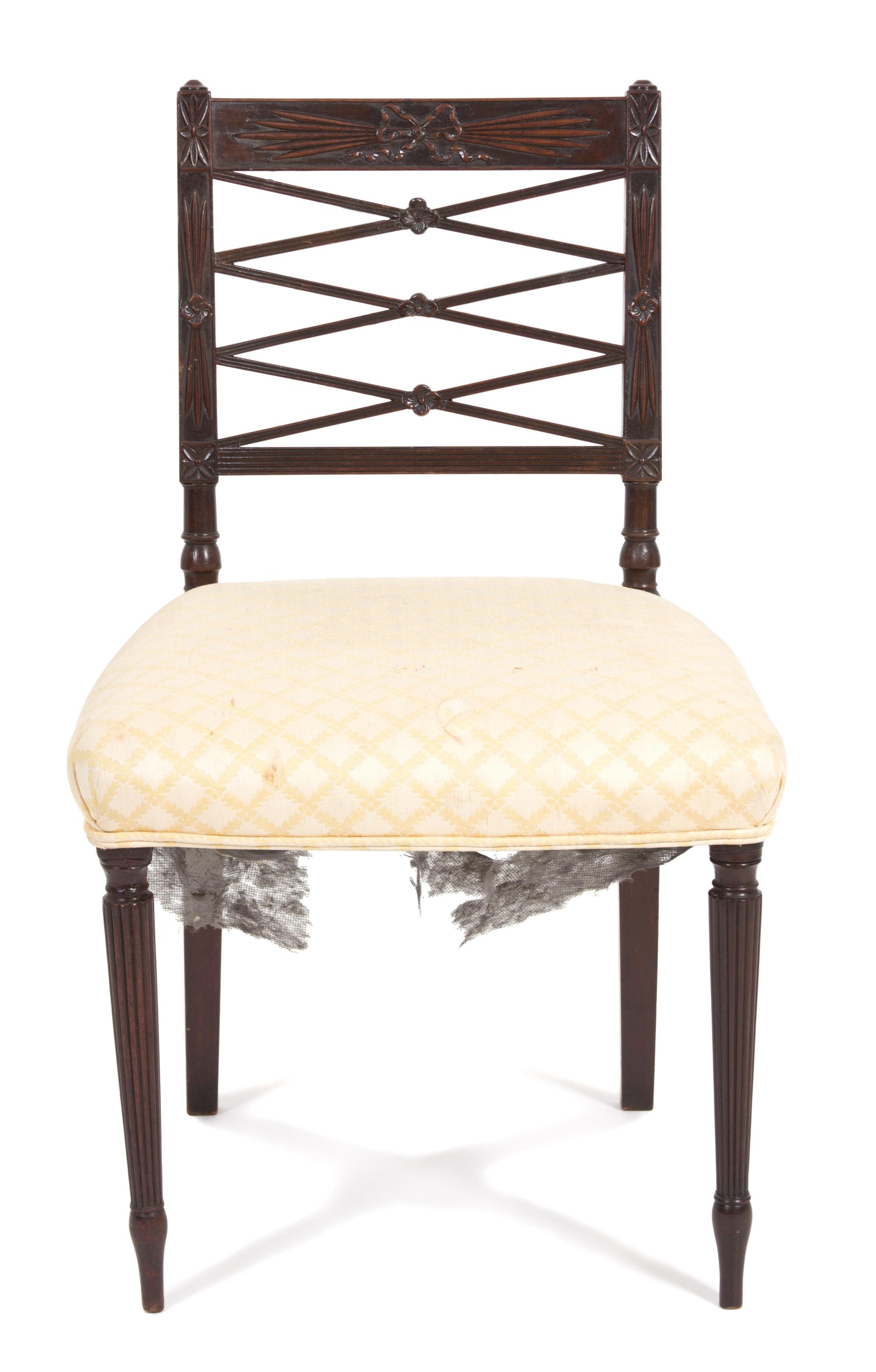 A Pair of Regency Style Carved Mahogany Side Chairs Height 33 1/4 inches.