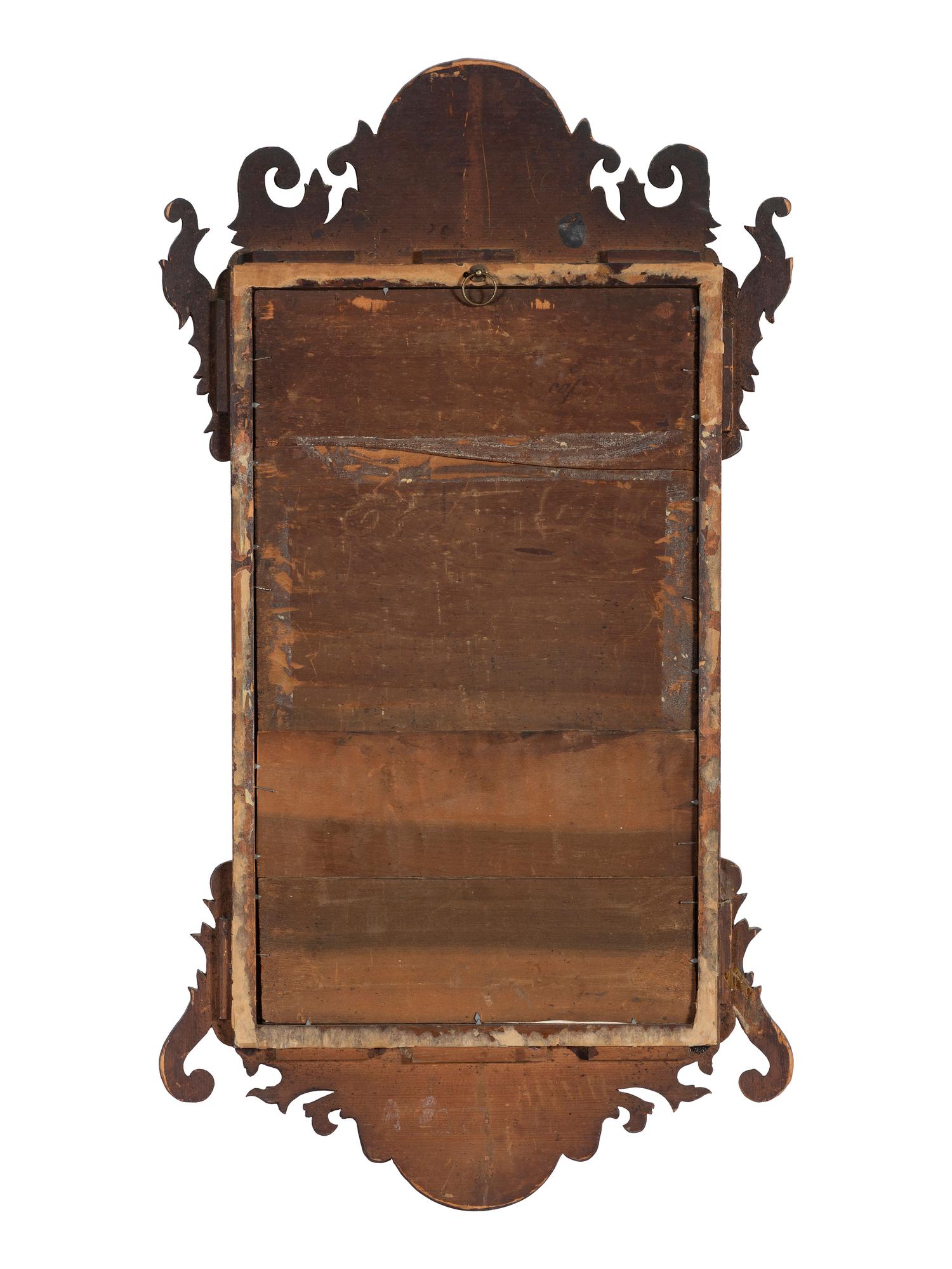 A Chippendale Carved Mahogany and Parcel Gilt Mirror