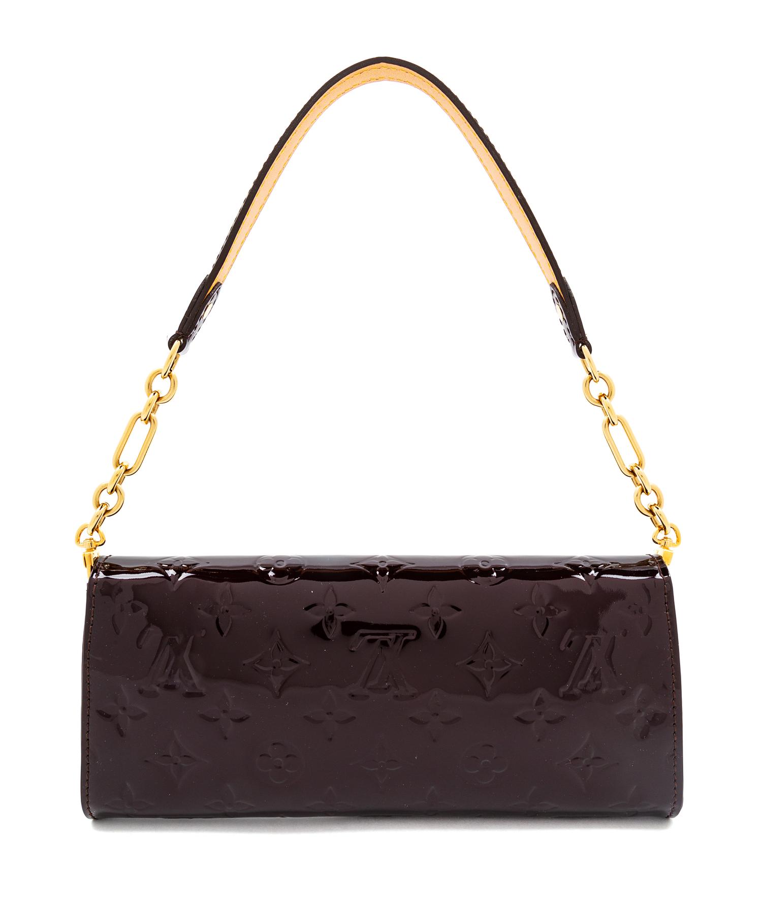 A Louis Vuitton Maroon Vernis Monogram Sunset Boulevard Bag, 4.5" H x 9.25" W x 1.25" D"; Shoulder drop: 7".