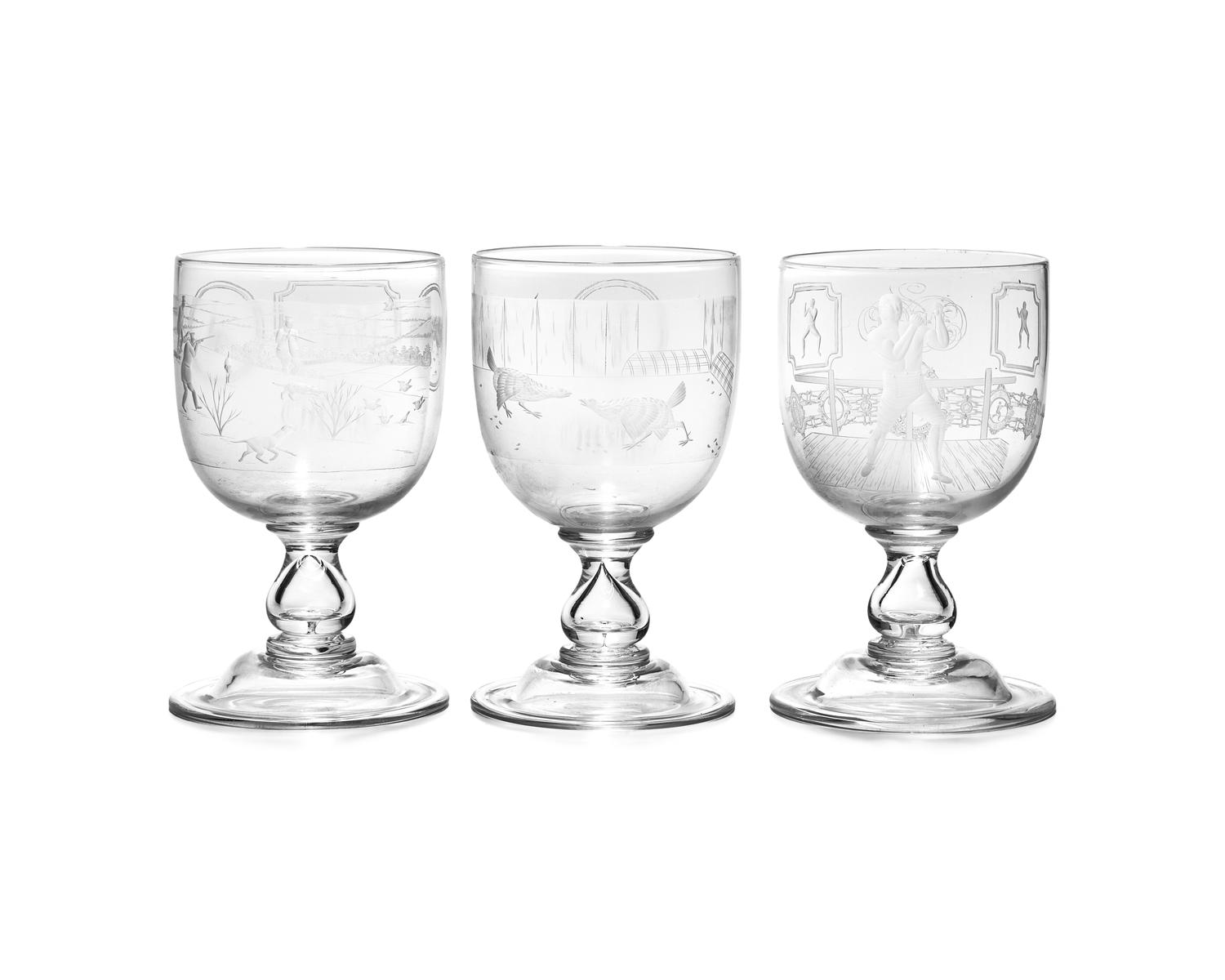 A Set of Seven Blown and Etched Glass Drinking Goblets