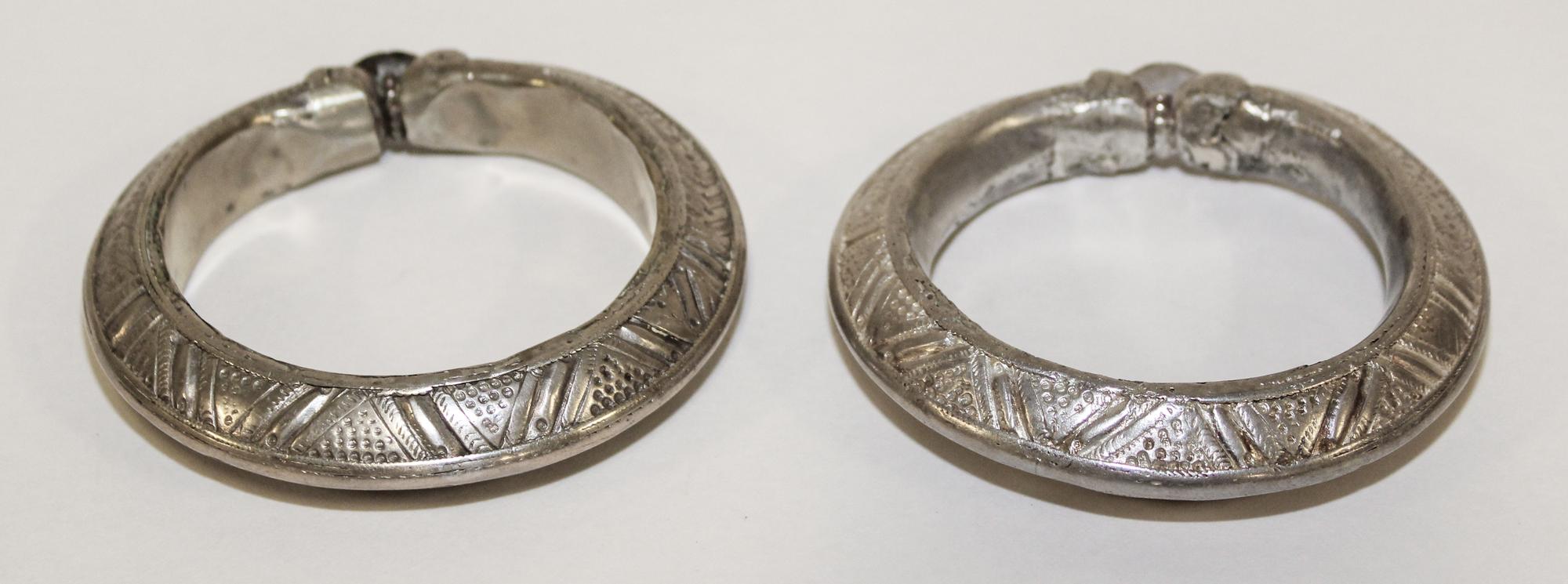 A Pair of Yemeni Silver Bangles Diameter of exterior 3 3/4 inches.