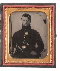 [CIVIL WAR]. Sixth plate tintype featuring a triply armed Union infantry private with a Smith & Wesson revolver and cocked forage cap.