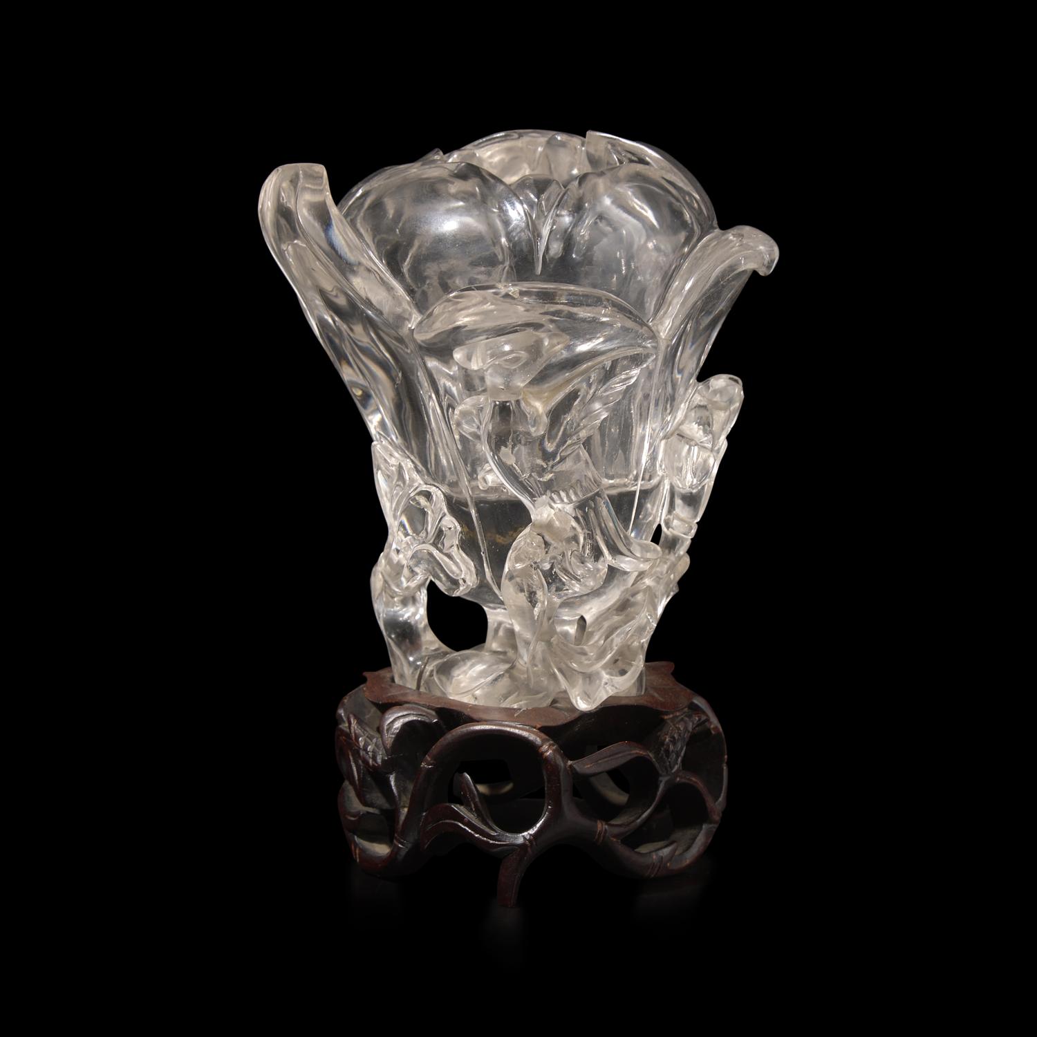 A Chinese Rock Crystal 'Magnolia' Vase with wood stand, 19th Century 清晚期 水晶雕玉蘭花插
