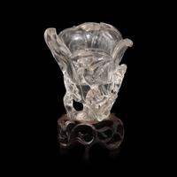 A Chinese Rock Crystal 'Magnolia' Vase with wood stand, 19th Century 清晚期 水晶雕玉蘭花插
