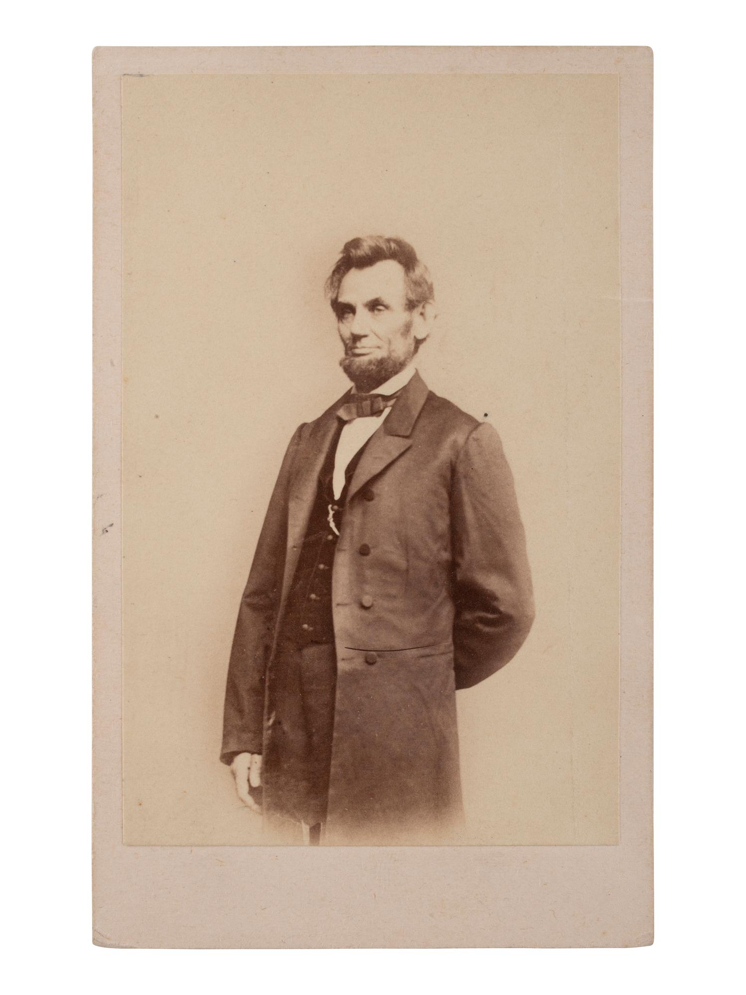 [LINCOLN, Abraham (1809-1865)]. A group of 12 CDVs of political figures, highlighted by a standing portrait of Abraham Lincoln.